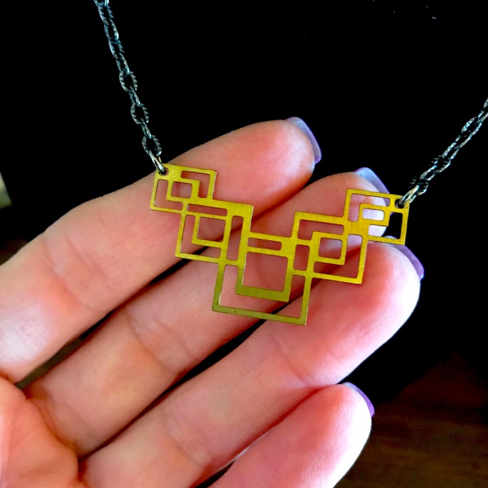 Artisan hand cut geometric mixed metal necklace